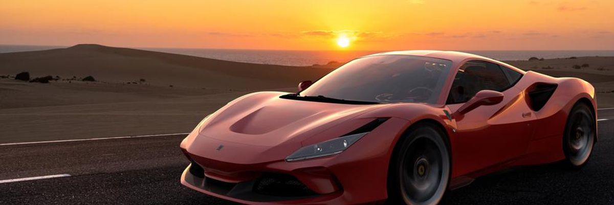 Piros színű Ferrari naplementében